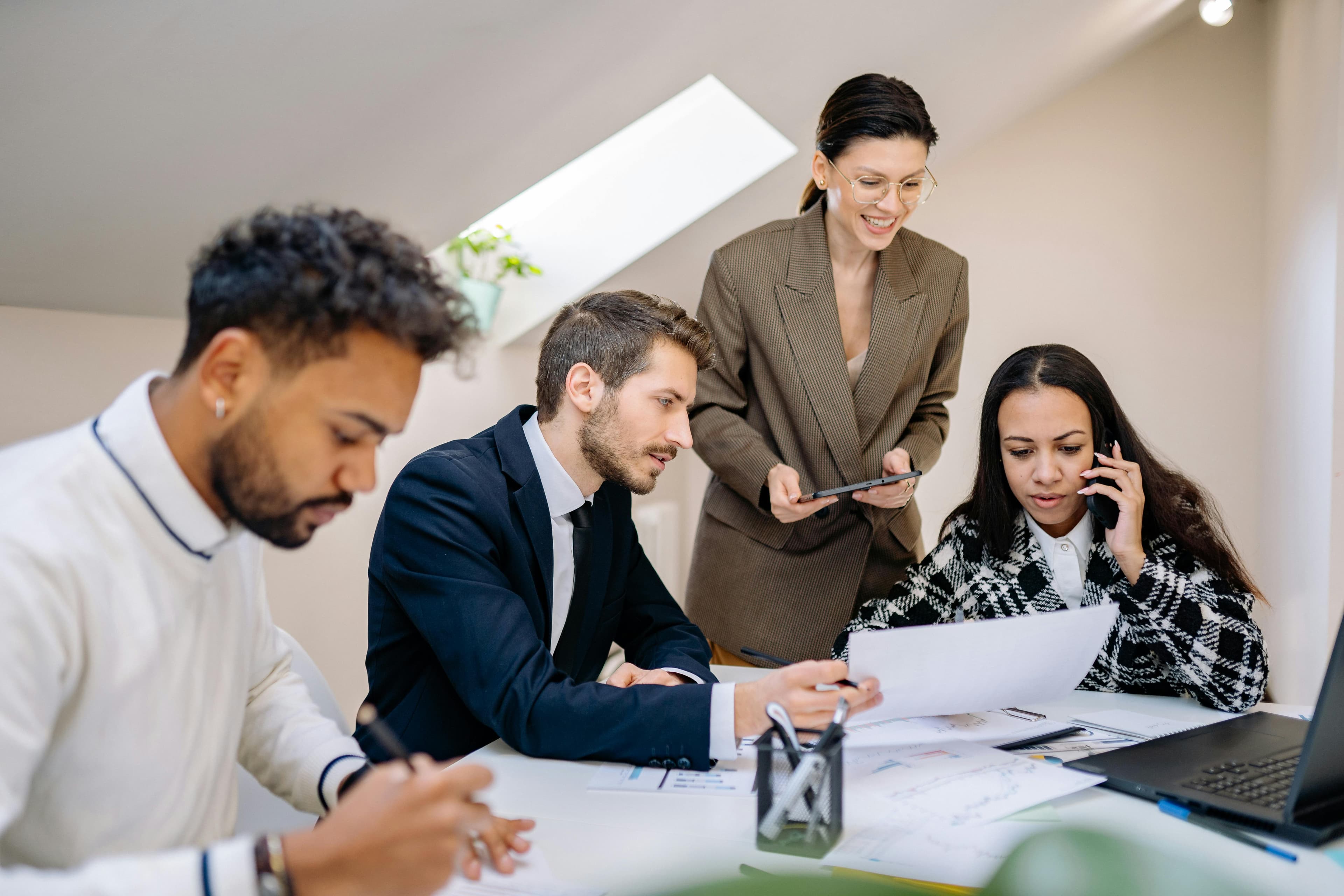 Four people working in the office