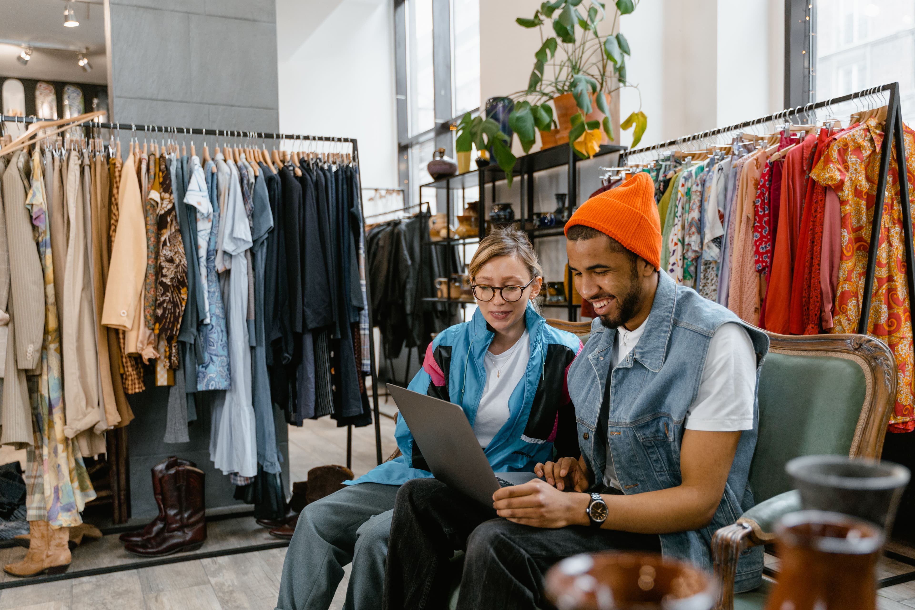 Two friends enjoying shopping in a stylish boutique