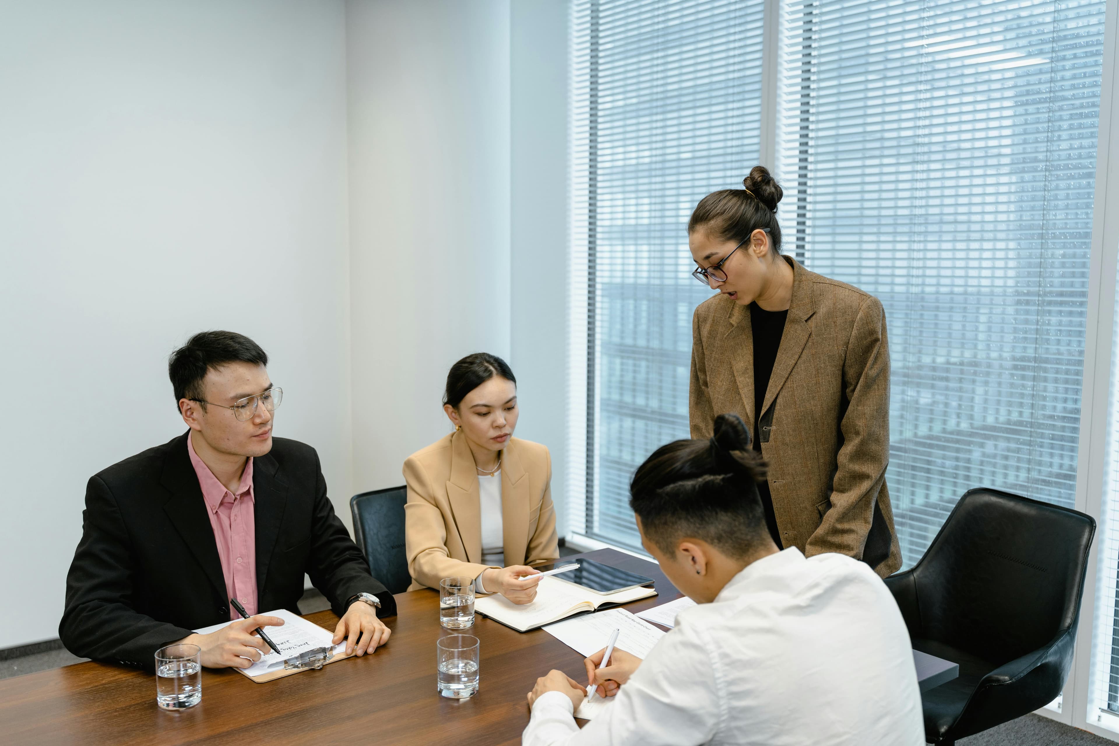 A group of people having a meeting in the office